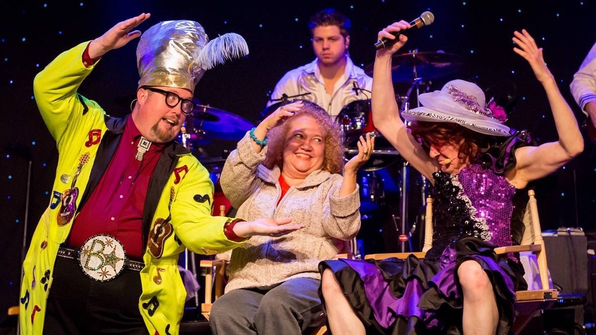 Performers on stage in hats on the comedy jamboree